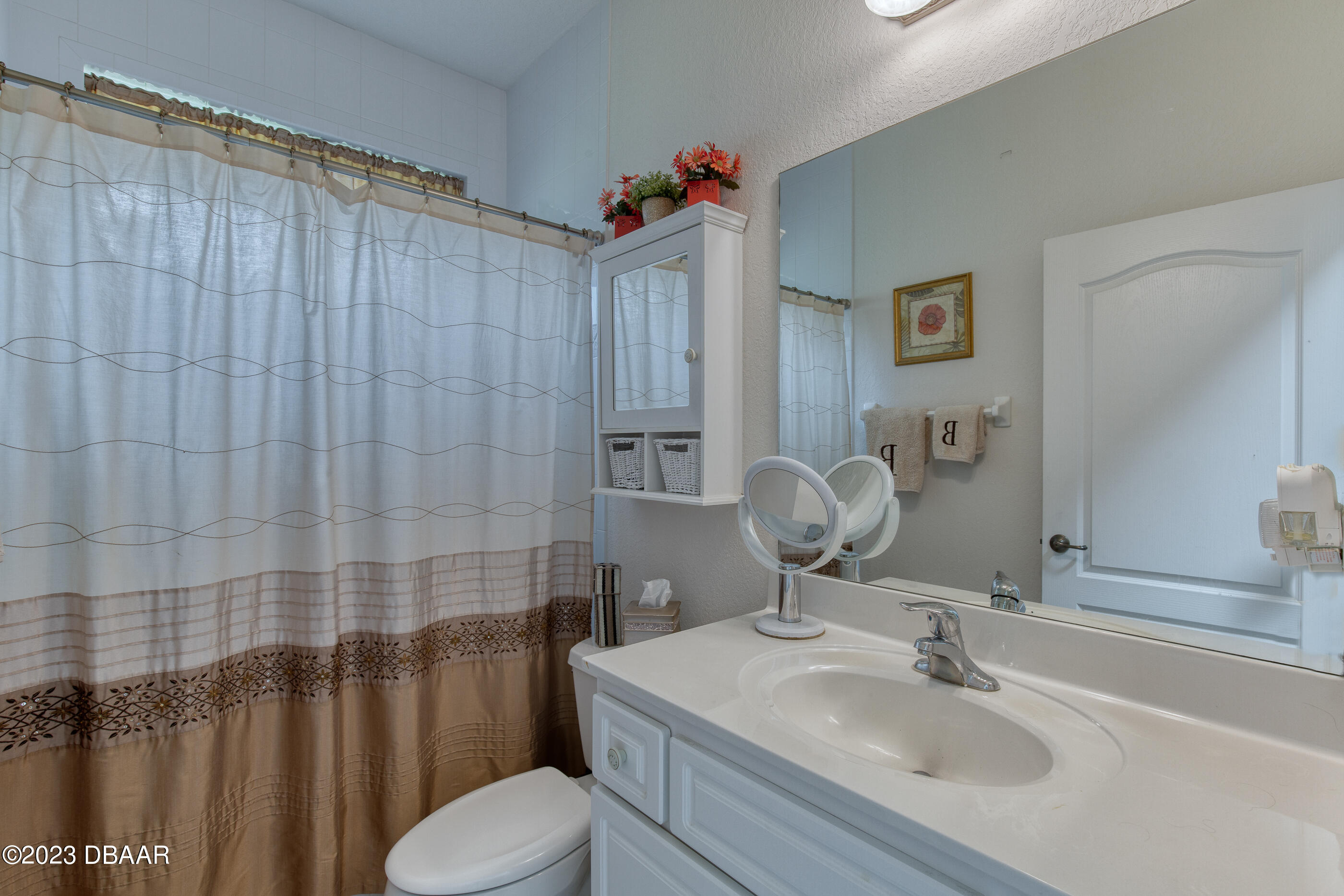 87 Timucuan Drive Ormond Beach, FL 32174 - Photo 30 of 63 a bathroom with a sink toilet and shower