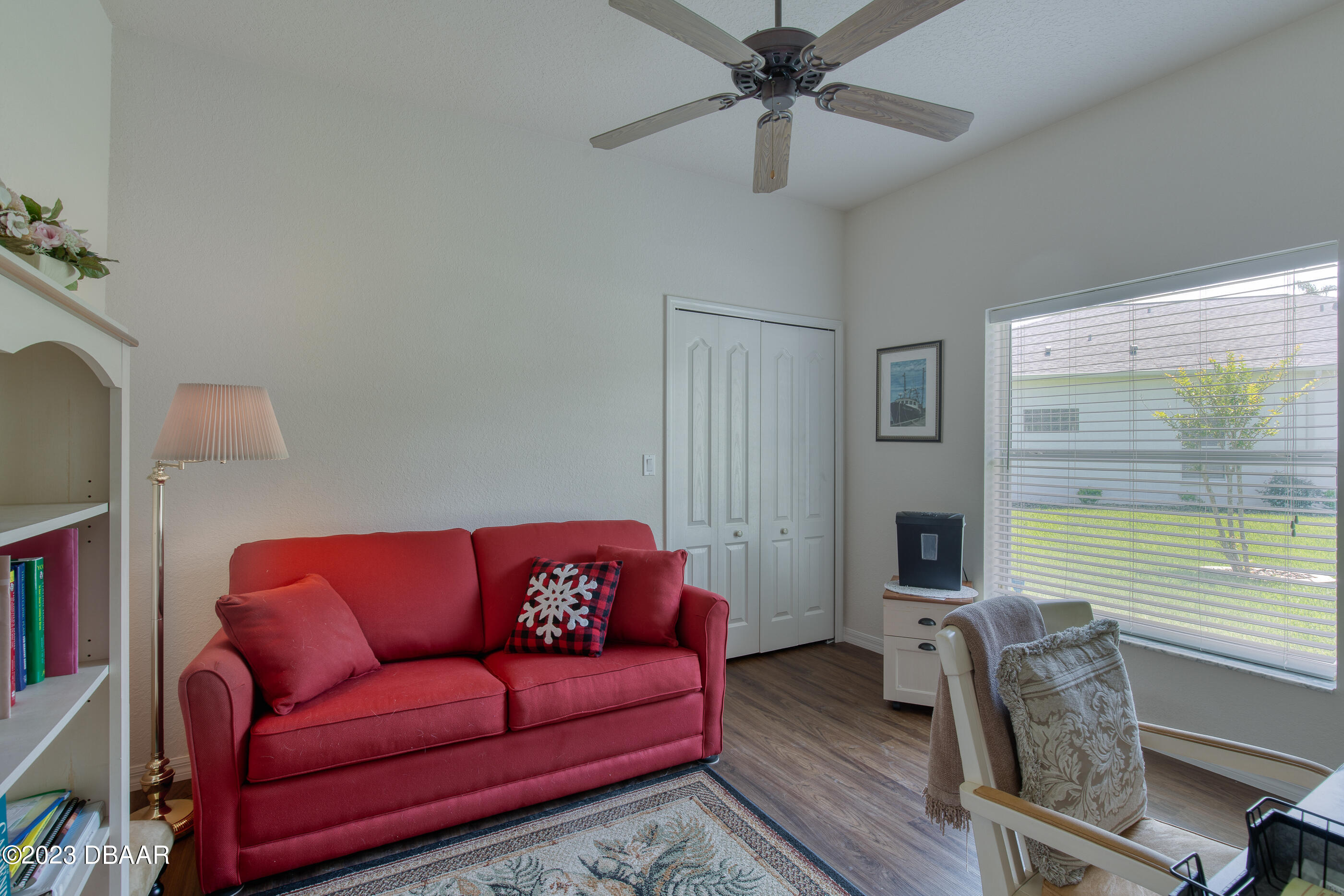 87 Timucuan Drive Ormond Beach, FL 32174 - Photo 34 of 63 a living room with furniture and a large window