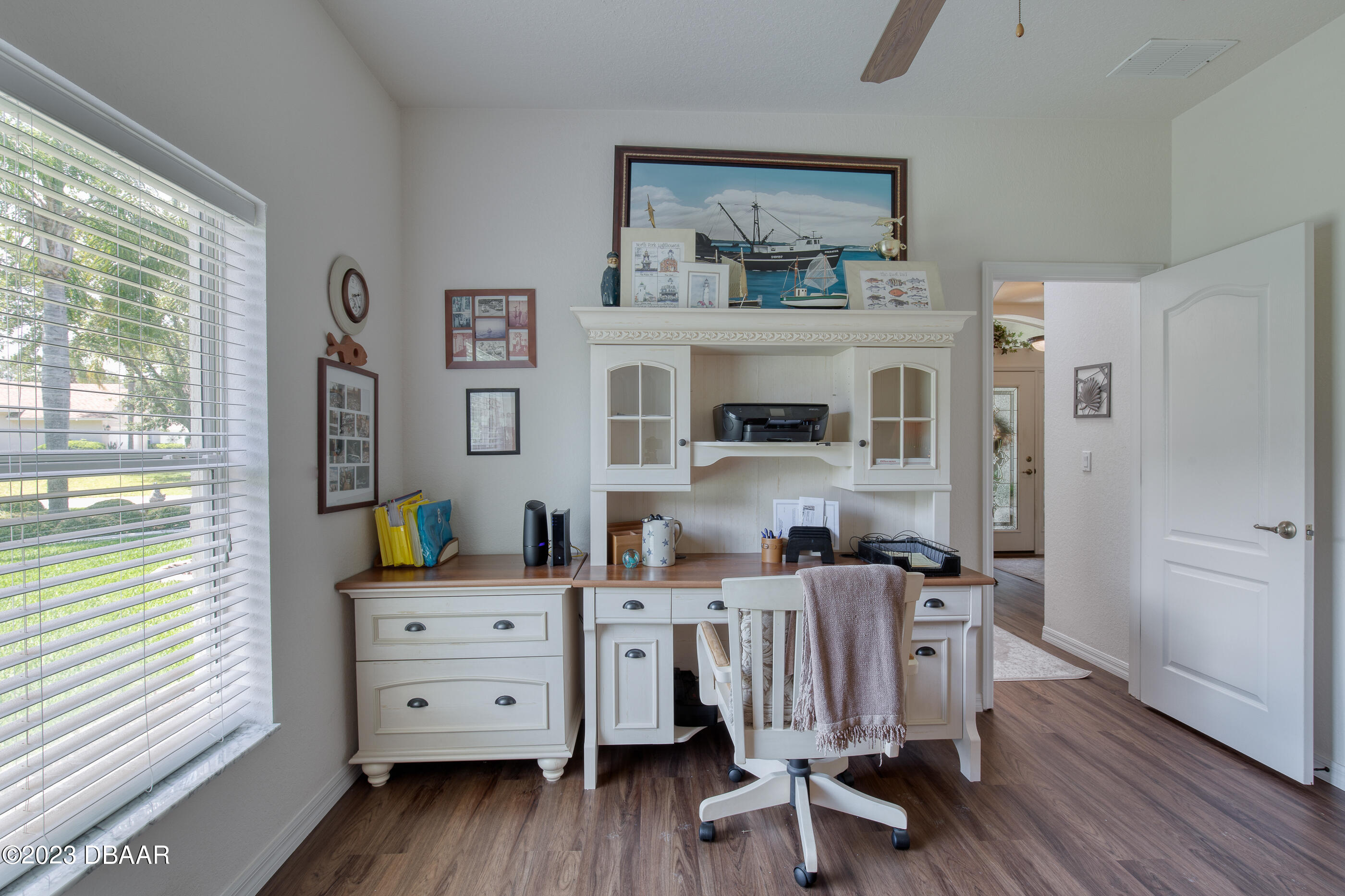 87 Timucuan Drive Ormond Beach, FL 32174 - Photo 35 of 63 a view of a workspace with furniture and wooden floor