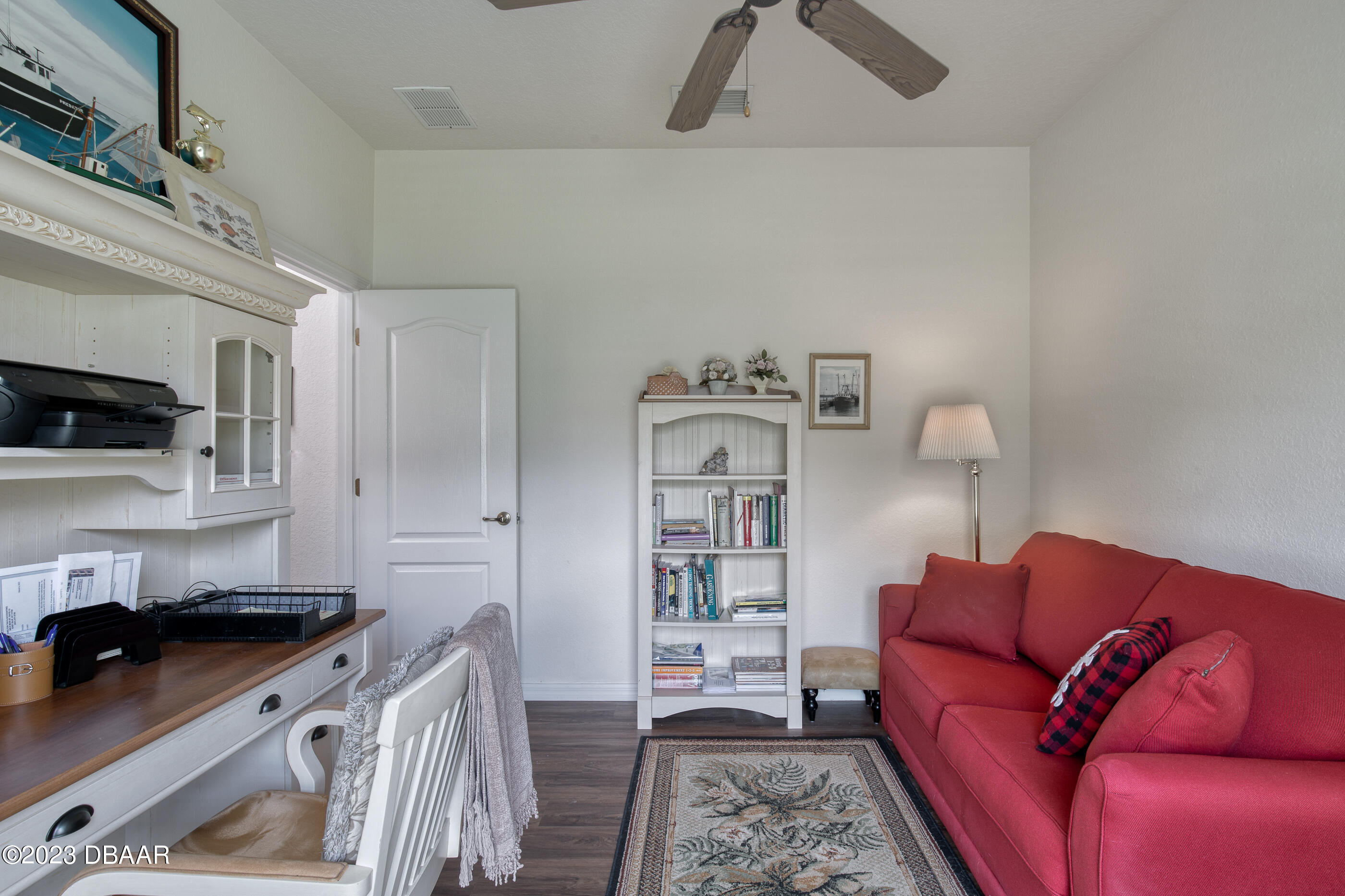 87 Timucuan Drive Ormond Beach, FL 32174 - Photo 36 of 63 a living room with furniture and a kitchen view