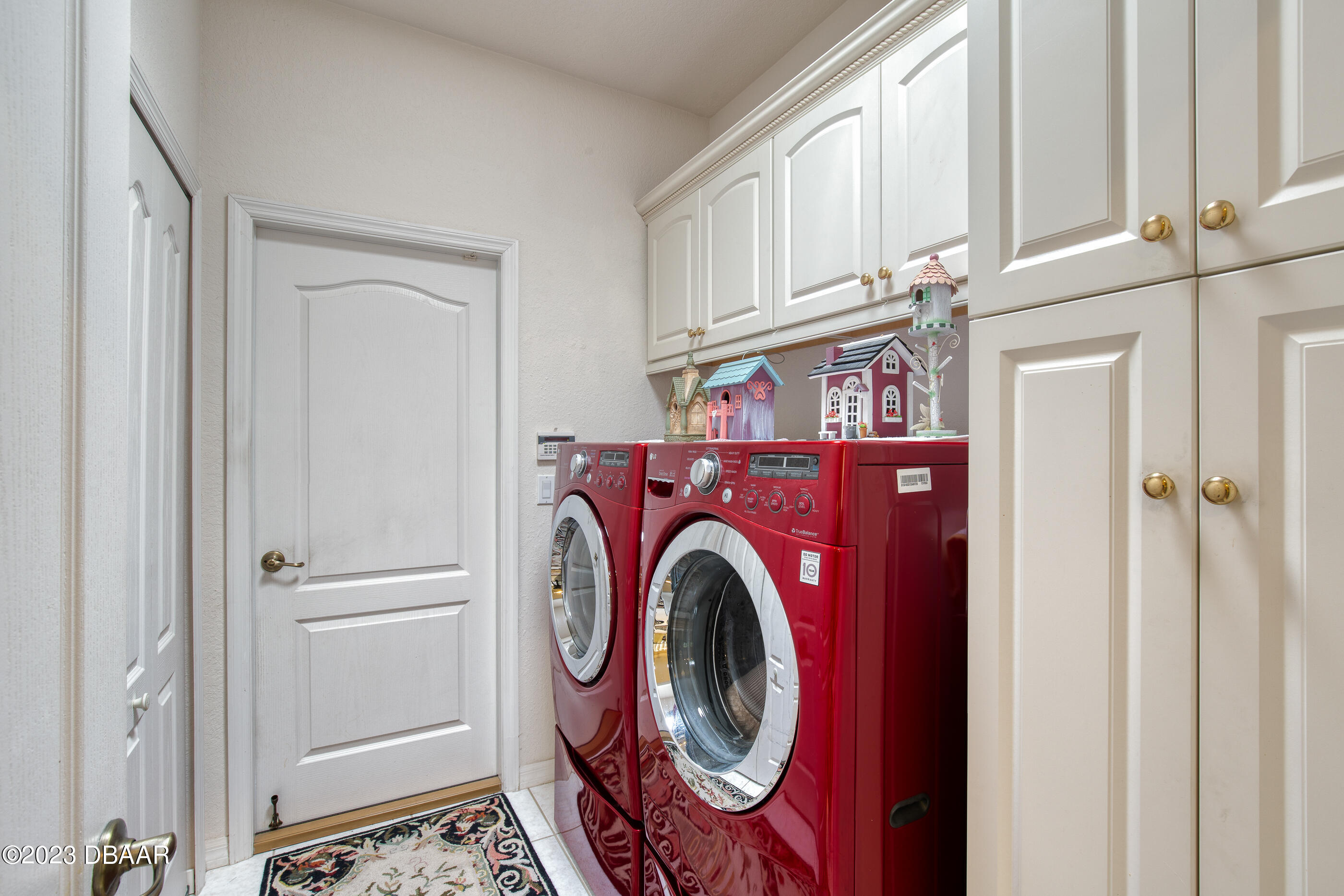 87 Timucuan Drive Ormond Beach, FL 32174 - Photo 37 of 63 a utility room with dryer and washer