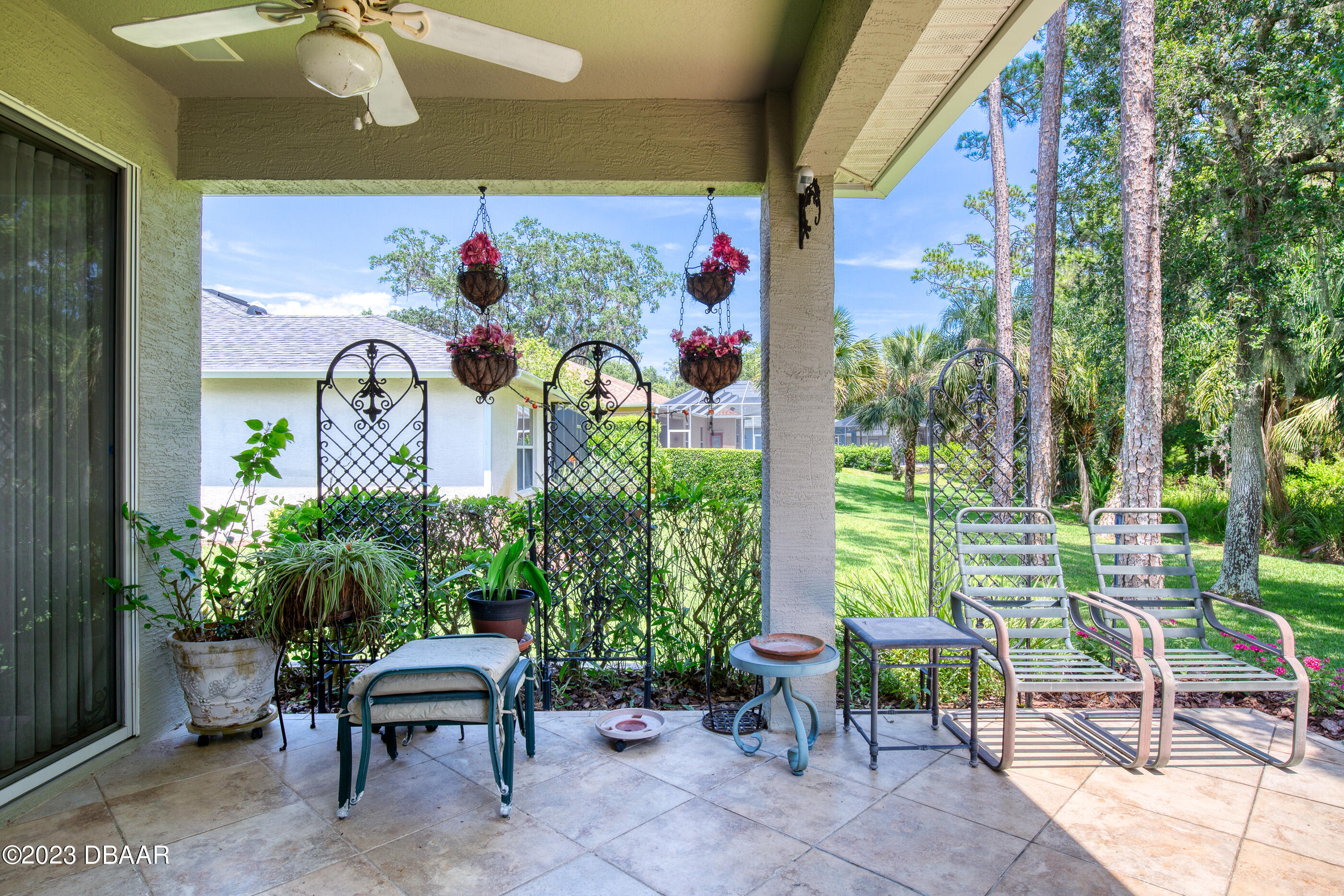 87 Timucuan Drive Ormond Beach, FL 32174 - Photo 39 of 63 a view of a chairs and table in a patio