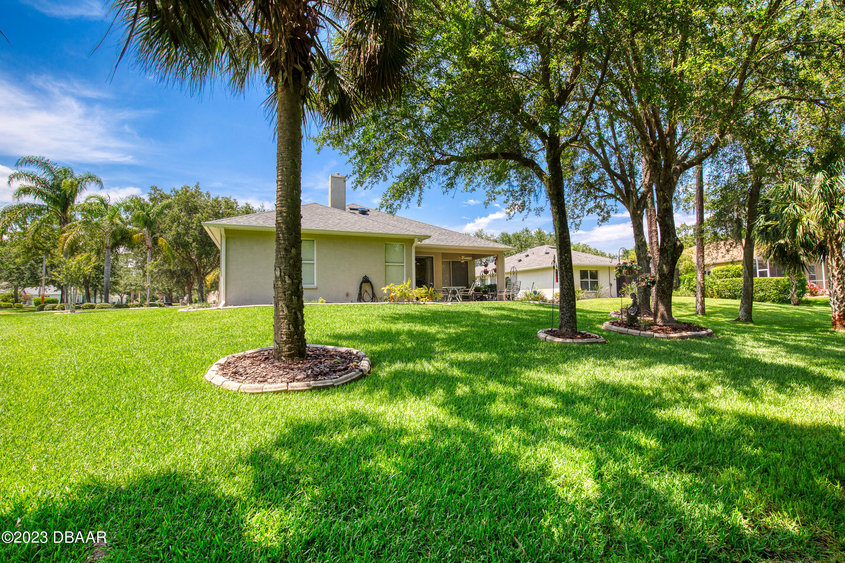 87 Timucuan Drive Ormond Beach, FL 32174 - Photo 45 of 63 a front view of a house with a yard