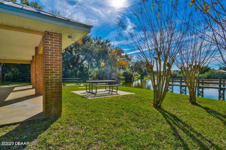87 Timucuan Drive Ormond Beach, FL 32174 - Photo 57 of 63 a view of a backyard with swimming pool