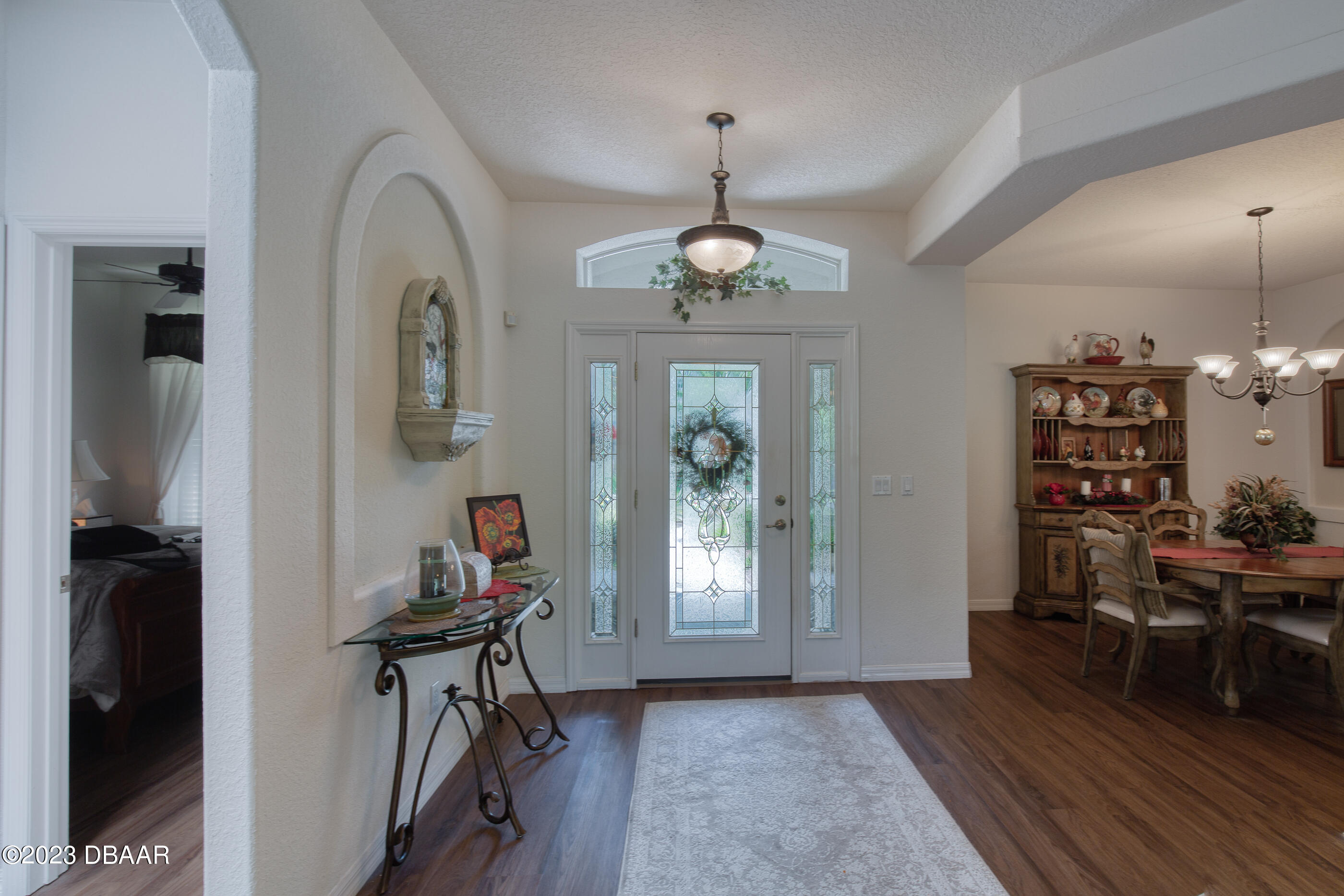 87 Timucuan Drive Ormond Beach, FL 32174 - Photo 6 of 63 a view of a livingroom with furniture and hardwood floor