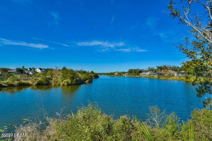 87 Timucuan Drive Ormond Beach, FL 32174 - Photo 62 of 63 a view of a lake in middle of forest