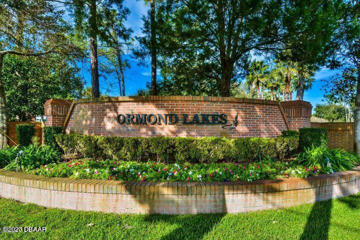 87 Timucuan Drive Ormond Beach, FL 32174 - Photo 63 of 63 a view of a house with a yard and a pond
