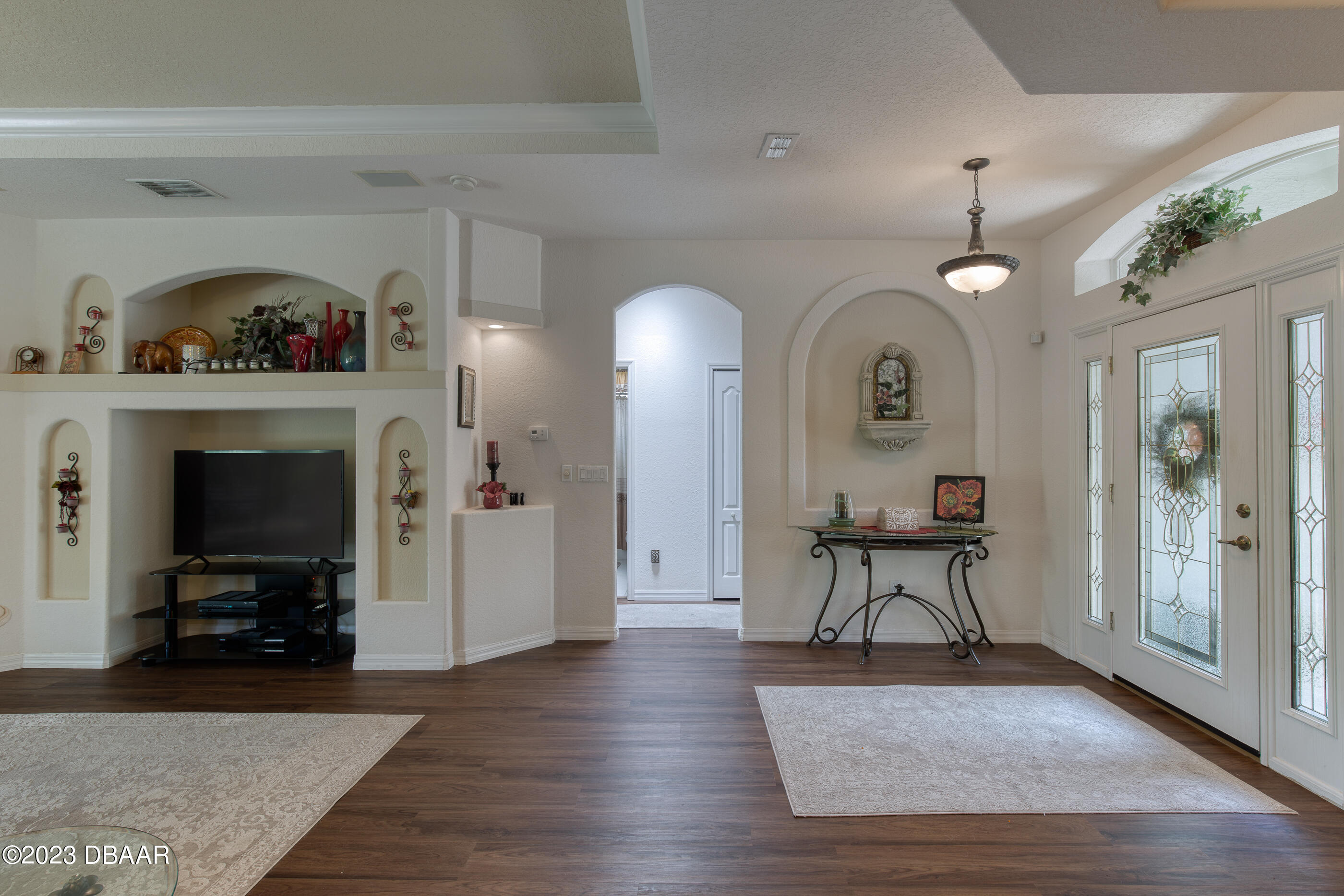 87 Timucuan Drive Ormond Beach, FL 32174 - Photo 7 of 63 a view of a livingroom with furniture and a fireplace