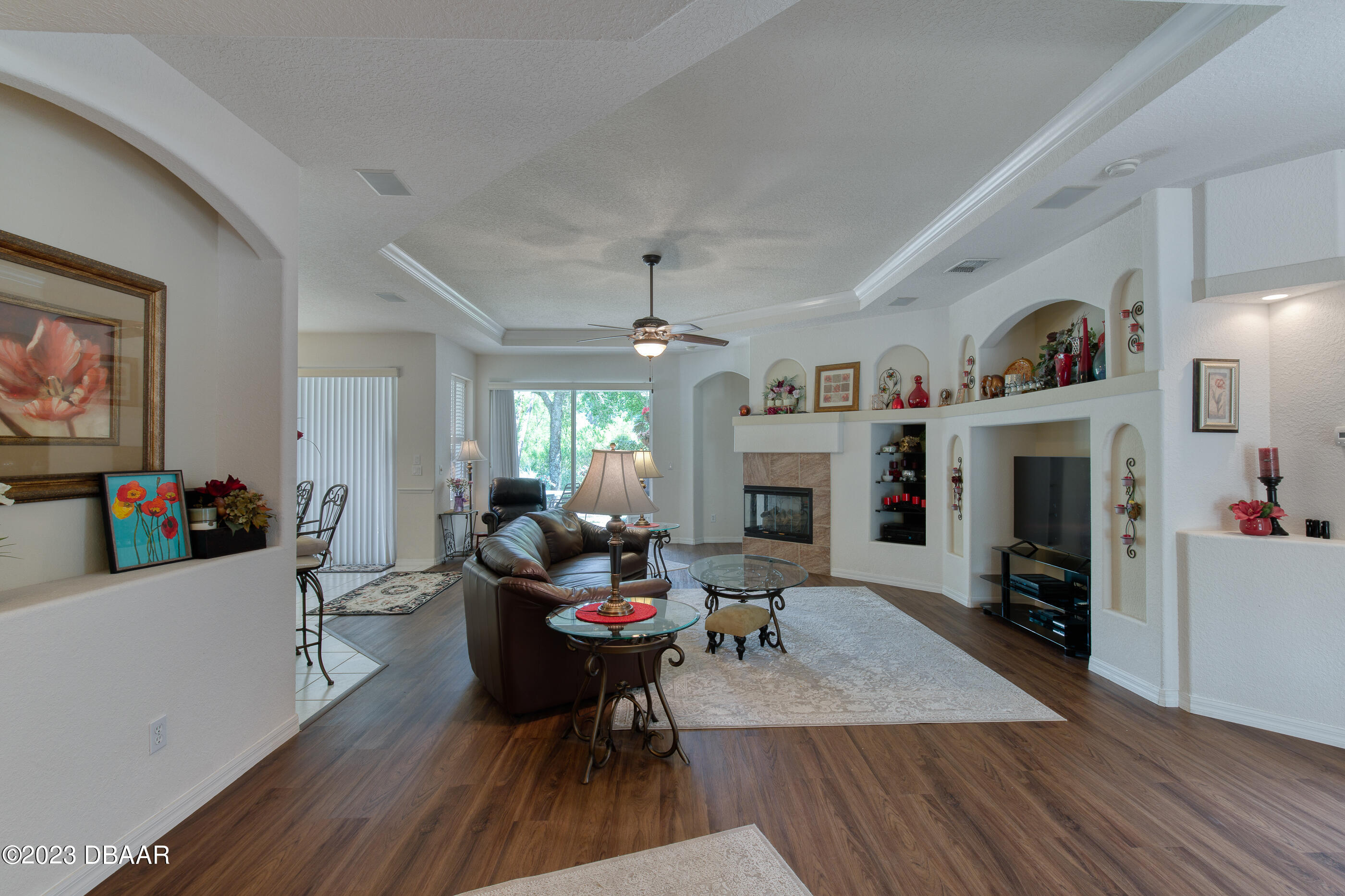 87 Timucuan Drive Ormond Beach, FL 32174 - Photo 8 of 63 a living room with furniture and a fireplace