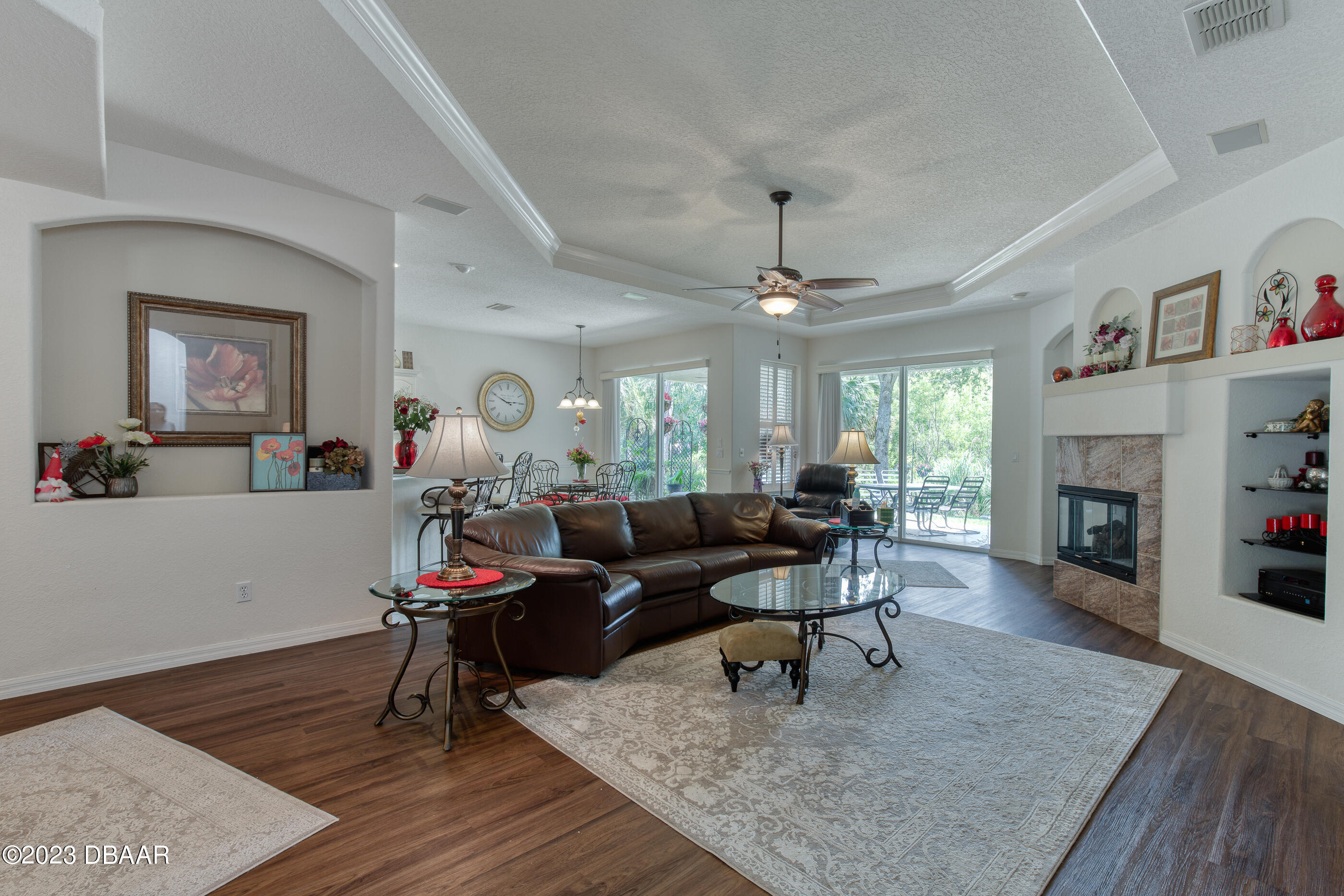 87 Timucuan Drive Ormond Beach, FL 32174 - Photo 9 of 63 a living room with furniture and a fireplace