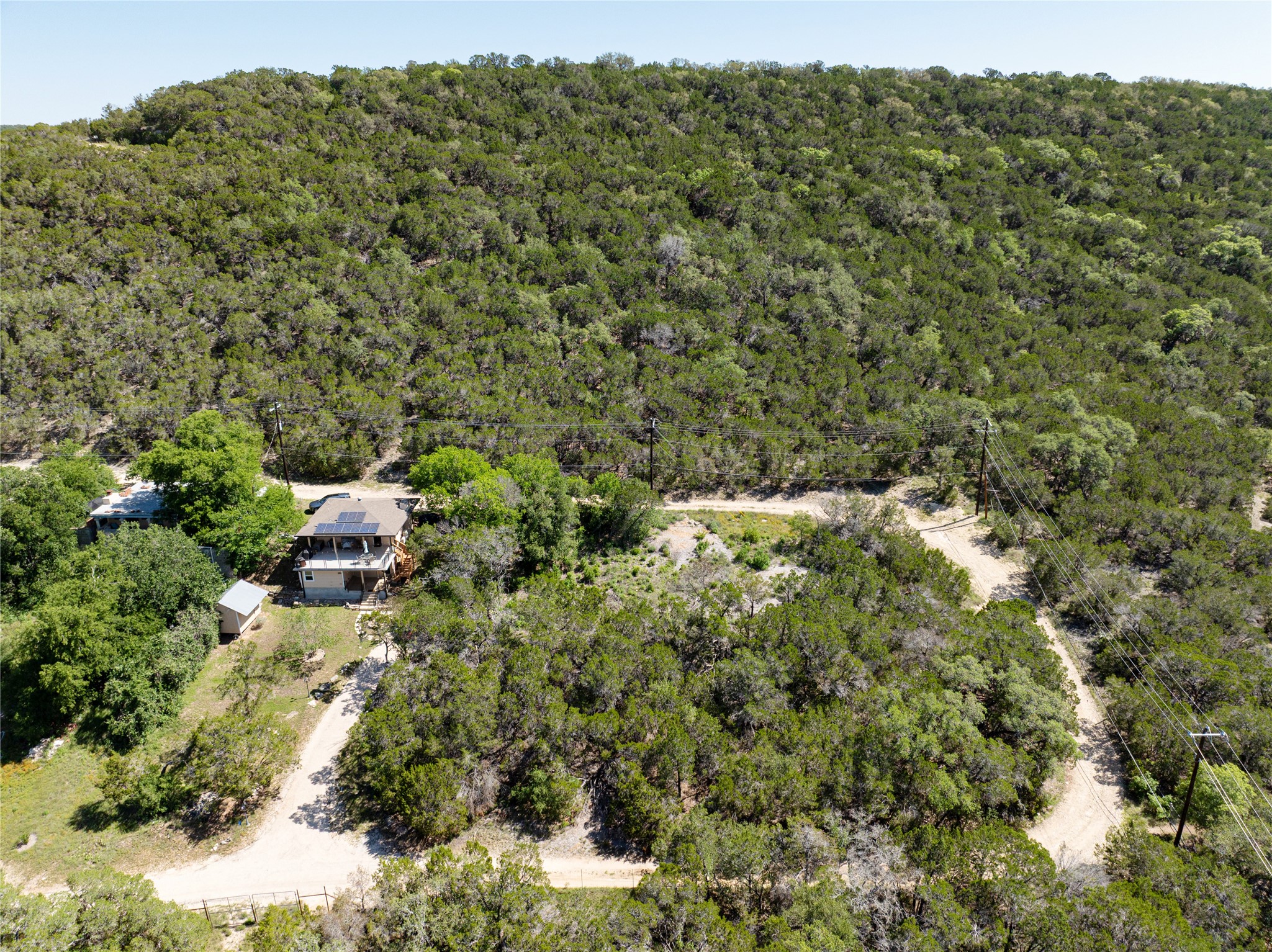 13560 Bullick Hollow Road Austin, TX 78726 - Photo 2 of 5 View of subject property from the back of the lot with a heavily wooded area.