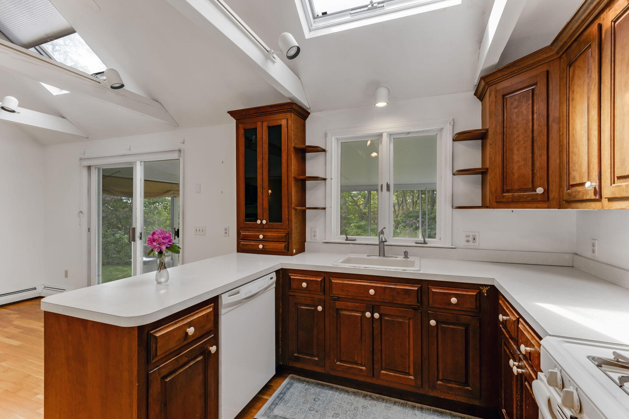 100 Potonumecot Road Chatham, MA 02633 - Photo 15 of 40 a kitchen with a sink cabinets and window