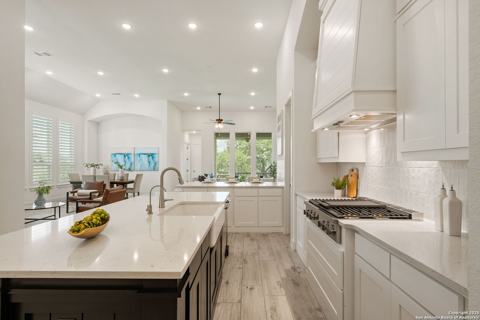 220 Corazon Boerne, TX 78006 - Photo 12 of 50 a kitchen with a sink a stove and chairs