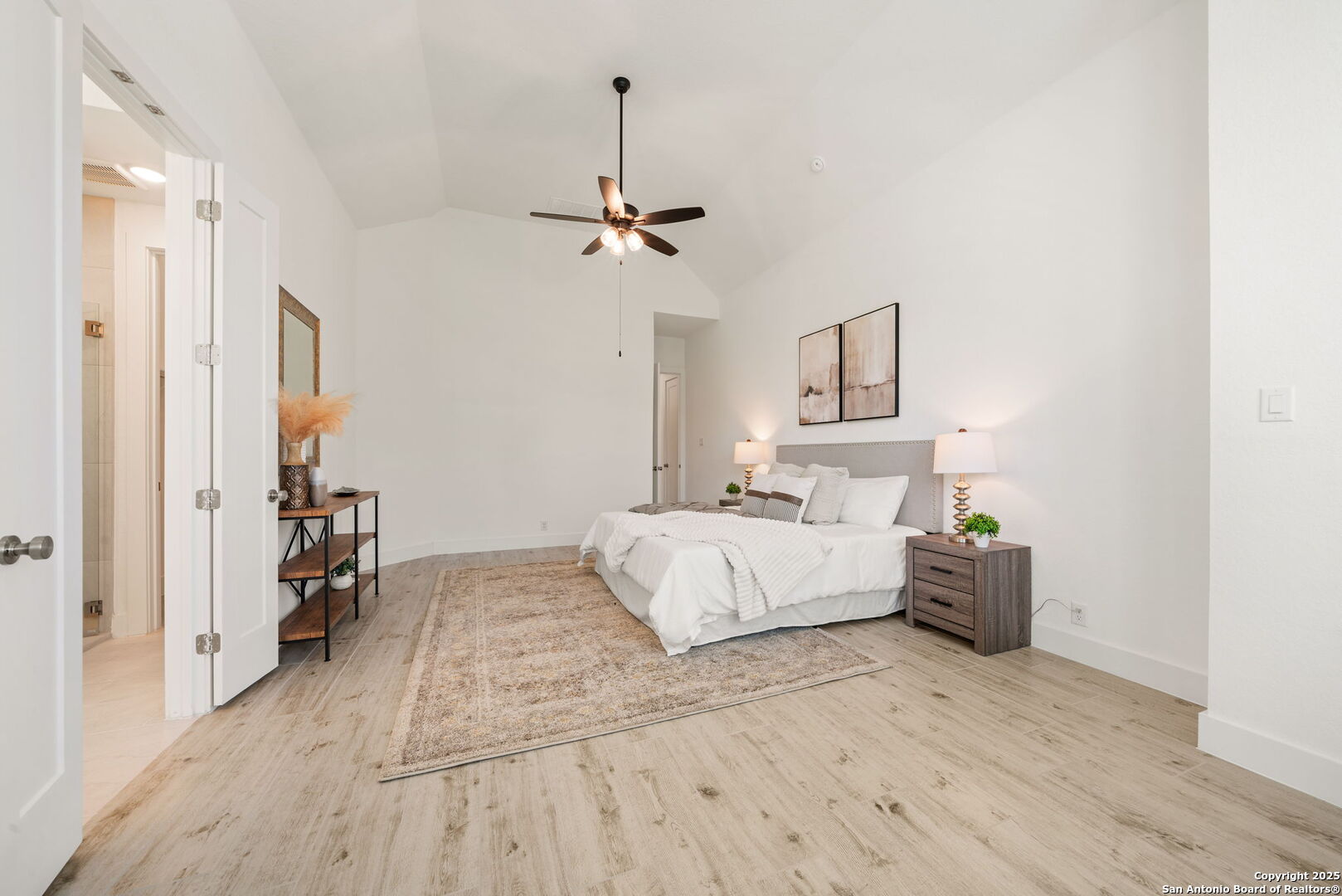 220 Corazon Boerne, TX 78006 - Photo 18 of 50 a spacious bedroom with a bed and furniture