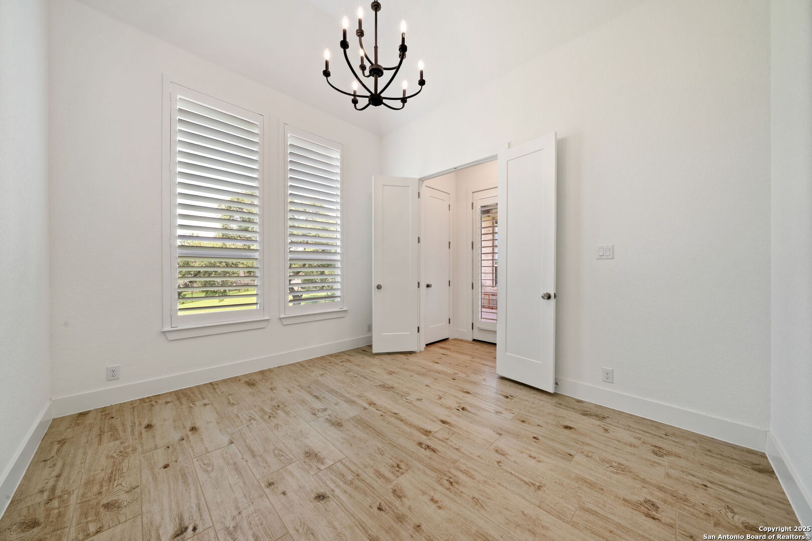 220 Corazon Boerne, TX 78006 - Photo 25 of 50 wooden floor in an empty room with a window