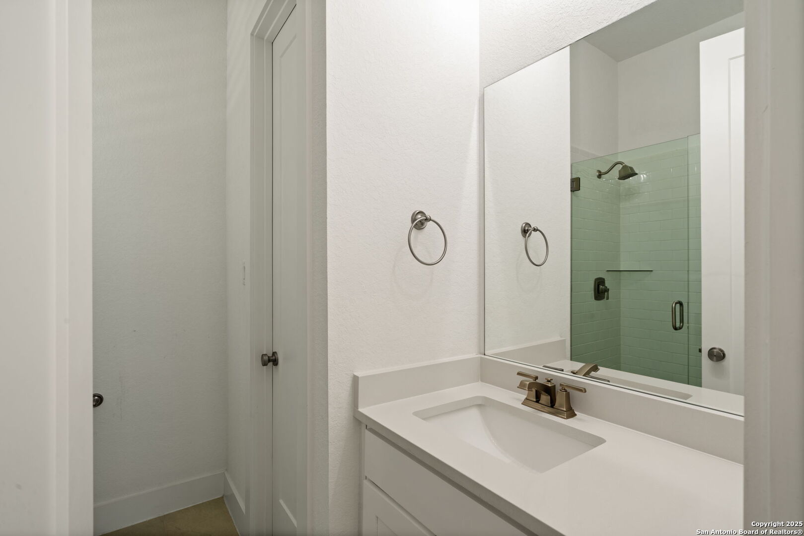 220 Corazon Boerne, TX 78006 - Photo 31 of 50 a bathroom with a sink and a mirror