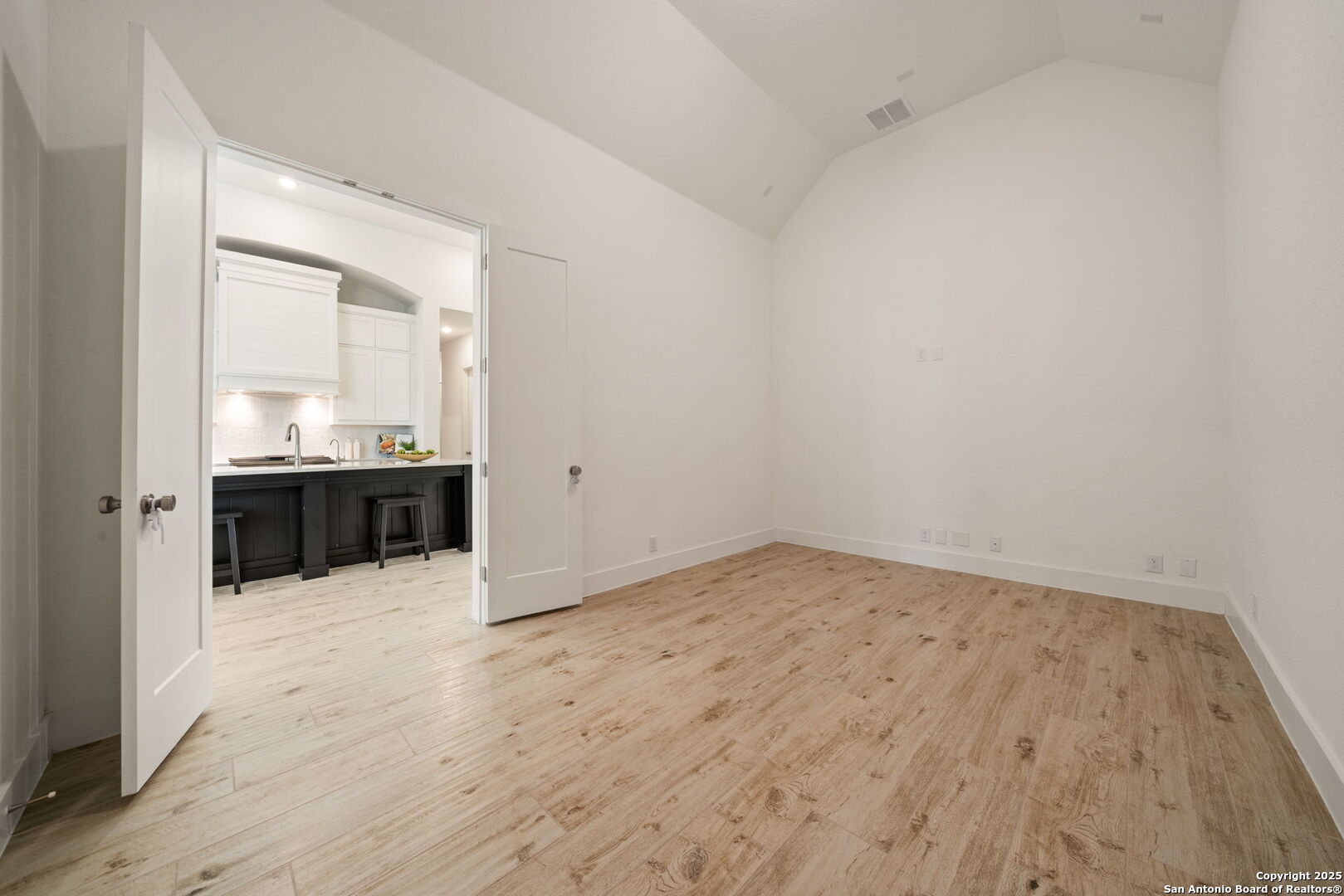 220 Corazon Boerne, TX 78006 - Photo 32 of 50 an empty room with wooden cabinet and mirrors