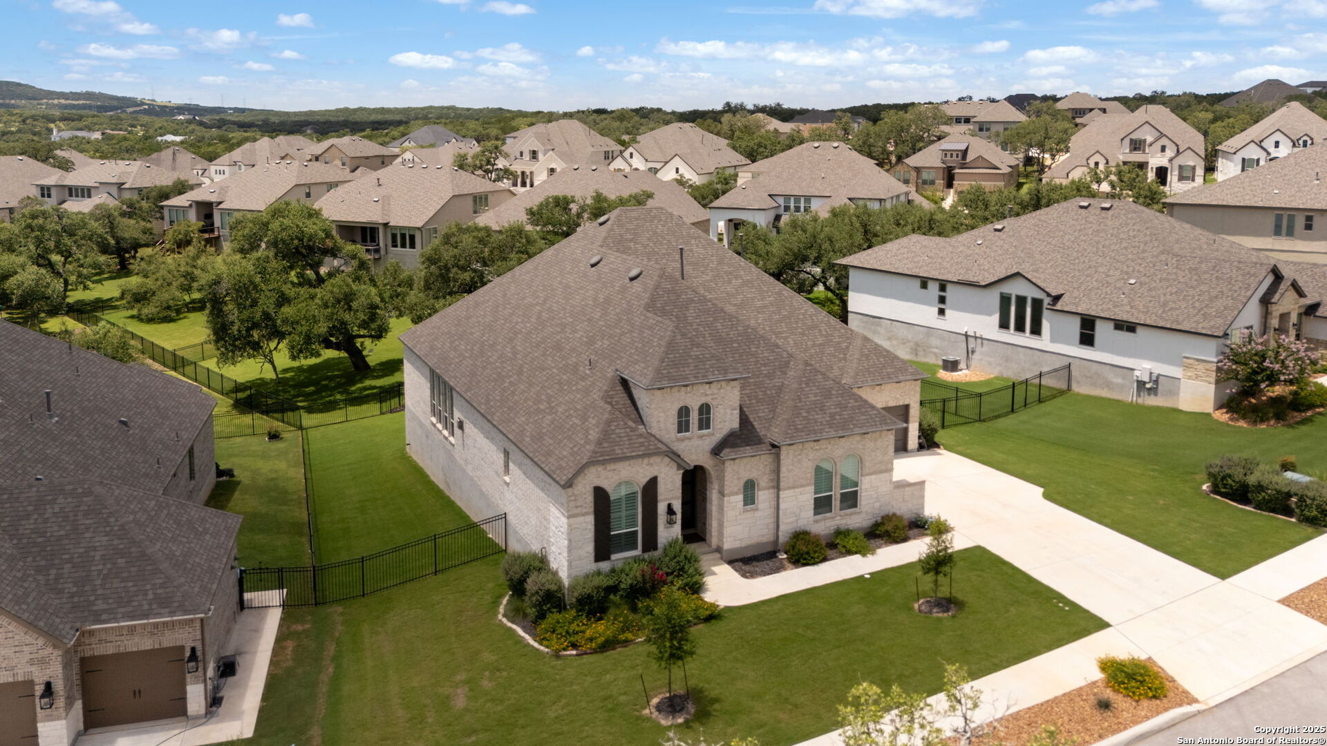 220 Corazon Boerne, TX 78006 - Photo 47 of 50 an aerial view of multiple houses with a yard