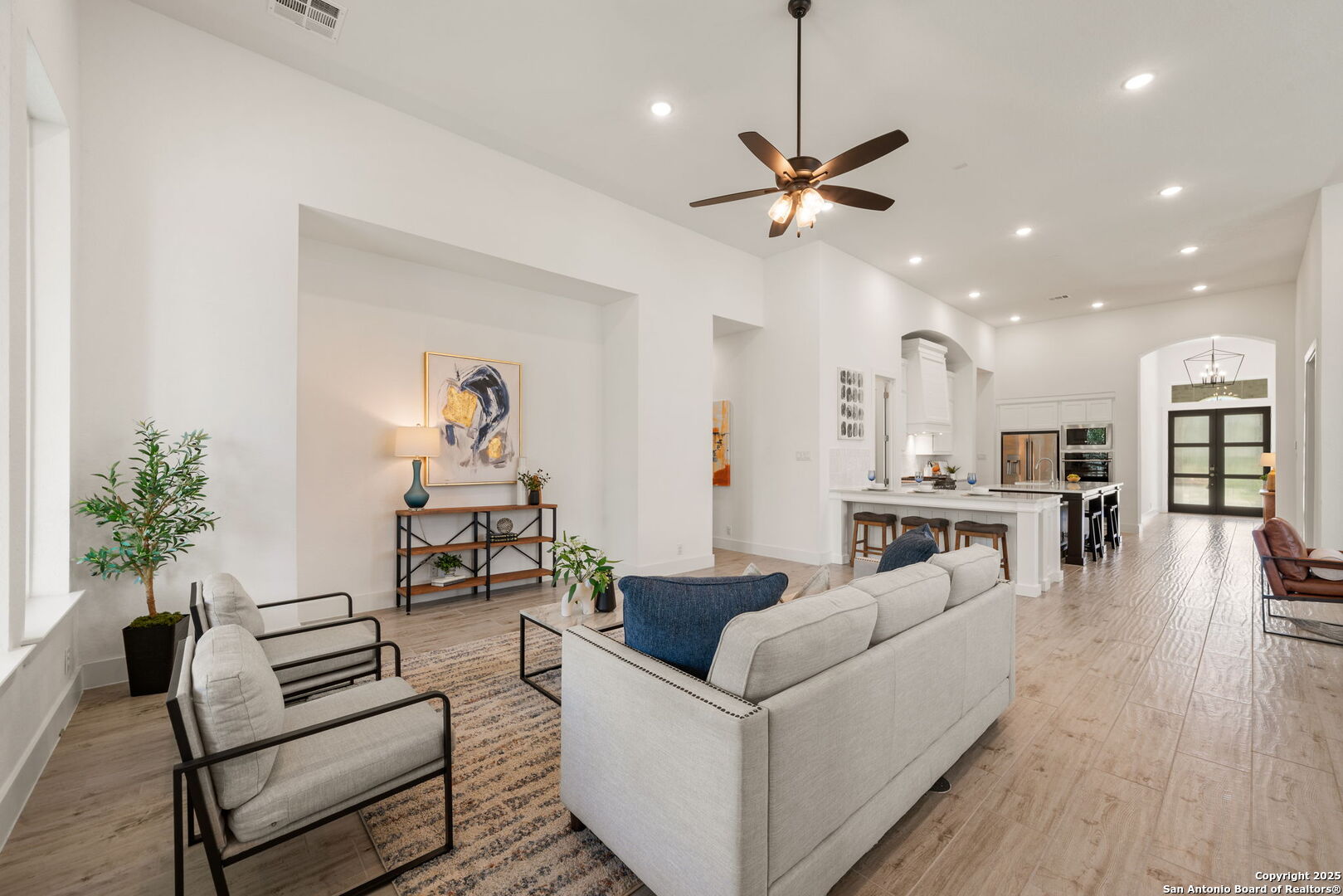 220 Corazon Boerne, TX 78006 - Photo 7 of 50 a living room with furniture kitchen view and a potted plant