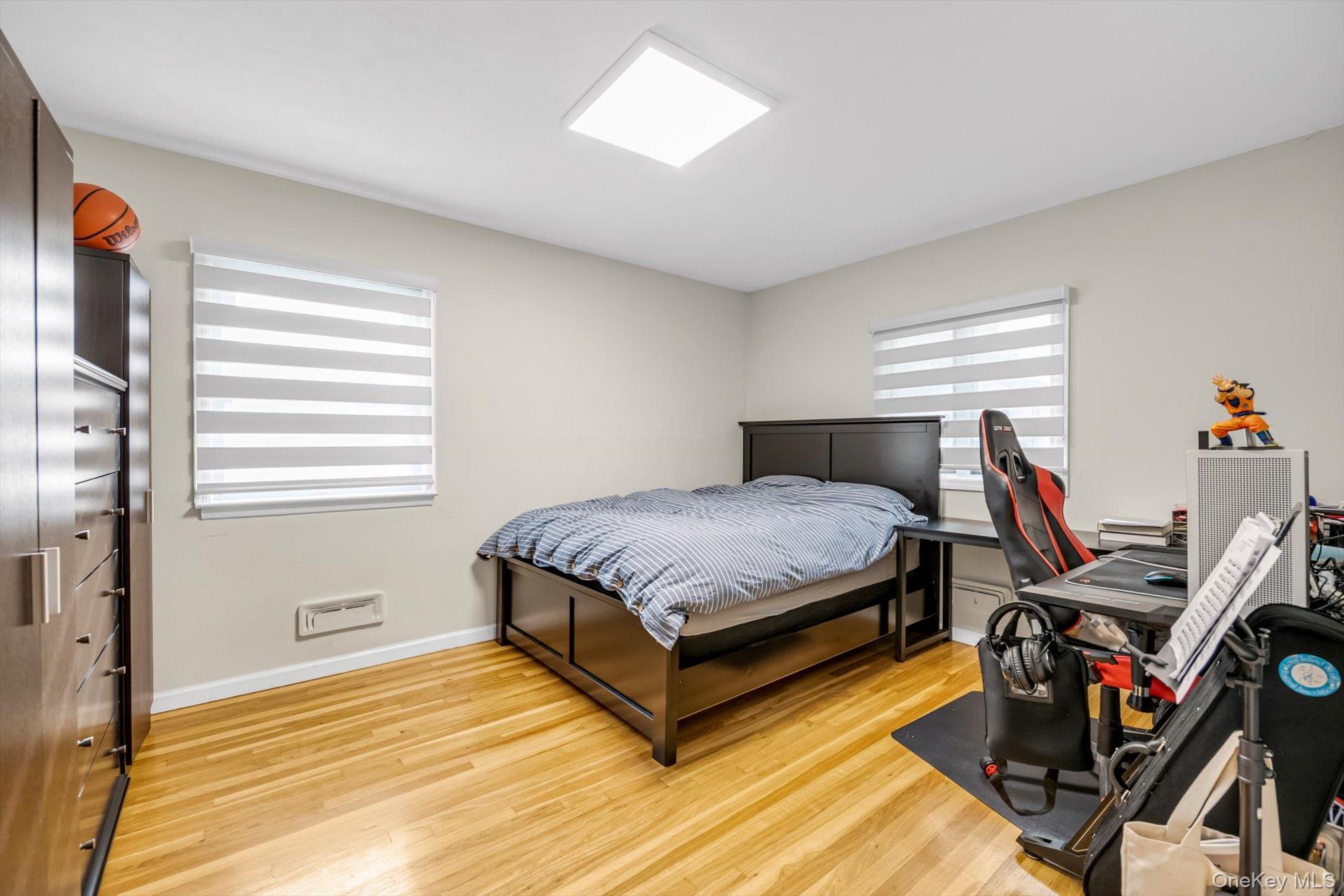 12 Julliard Drive Plainview, NY 11803 - Photo 11 of 23 Bedroom with light wood-style flooring