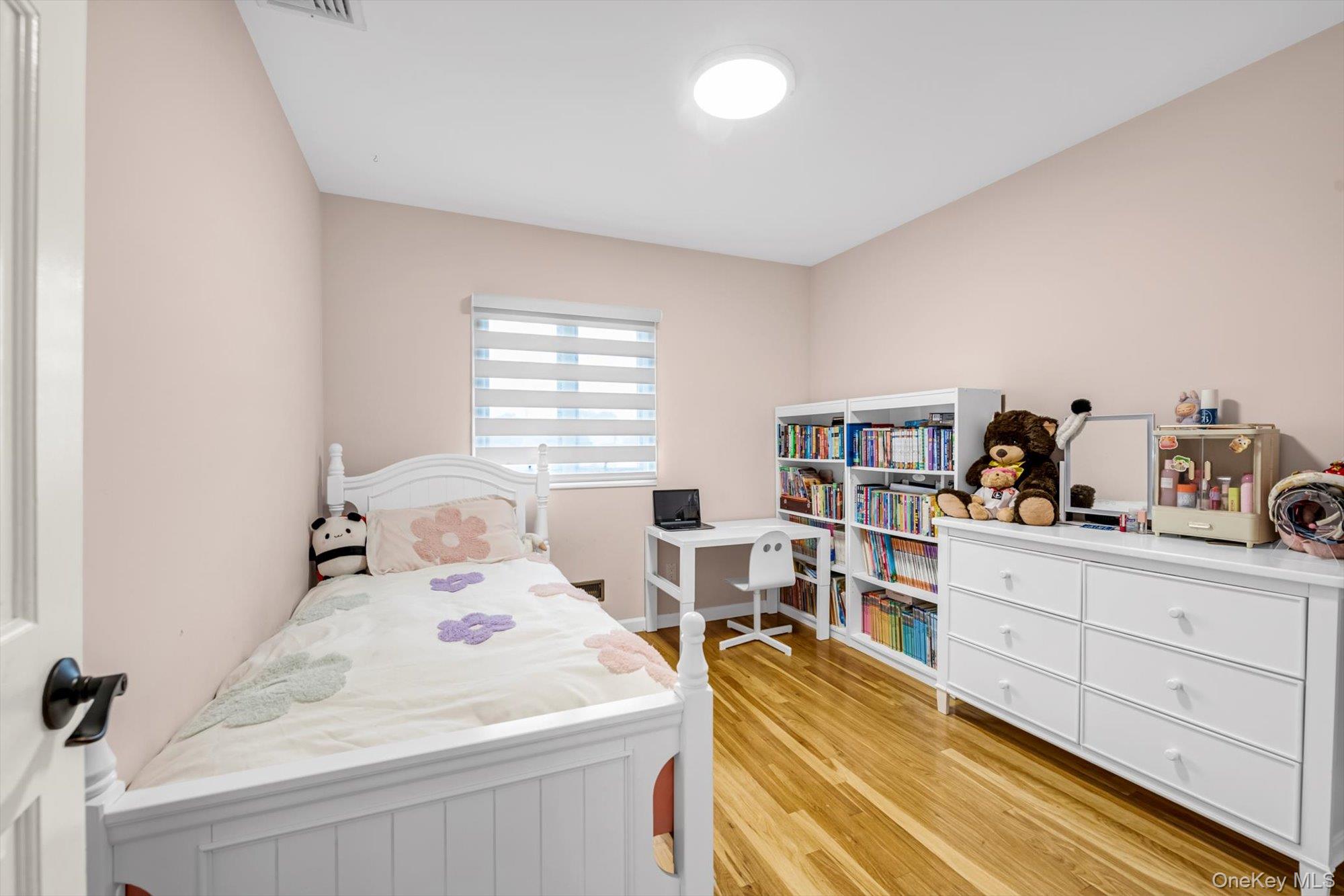12 Julliard Drive Plainview, NY 11803 - Photo 12 of 23 Bedroom featuring light wood-style flooring