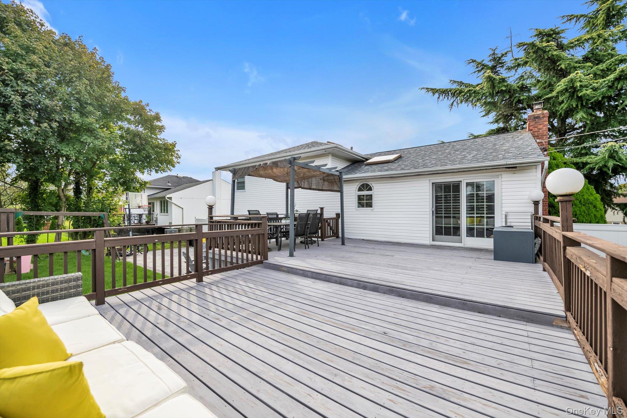 12 Julliard Drive Plainview, NY 11803 - Photo 19 of 23 Wooden terrace with outdoor dining area