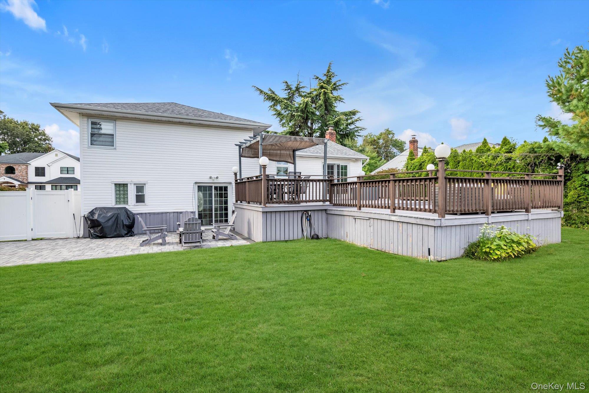 12 Julliard Drive Plainview, NY 11803 - Photo 21 of 23 Rear view of house with a patio and a deck