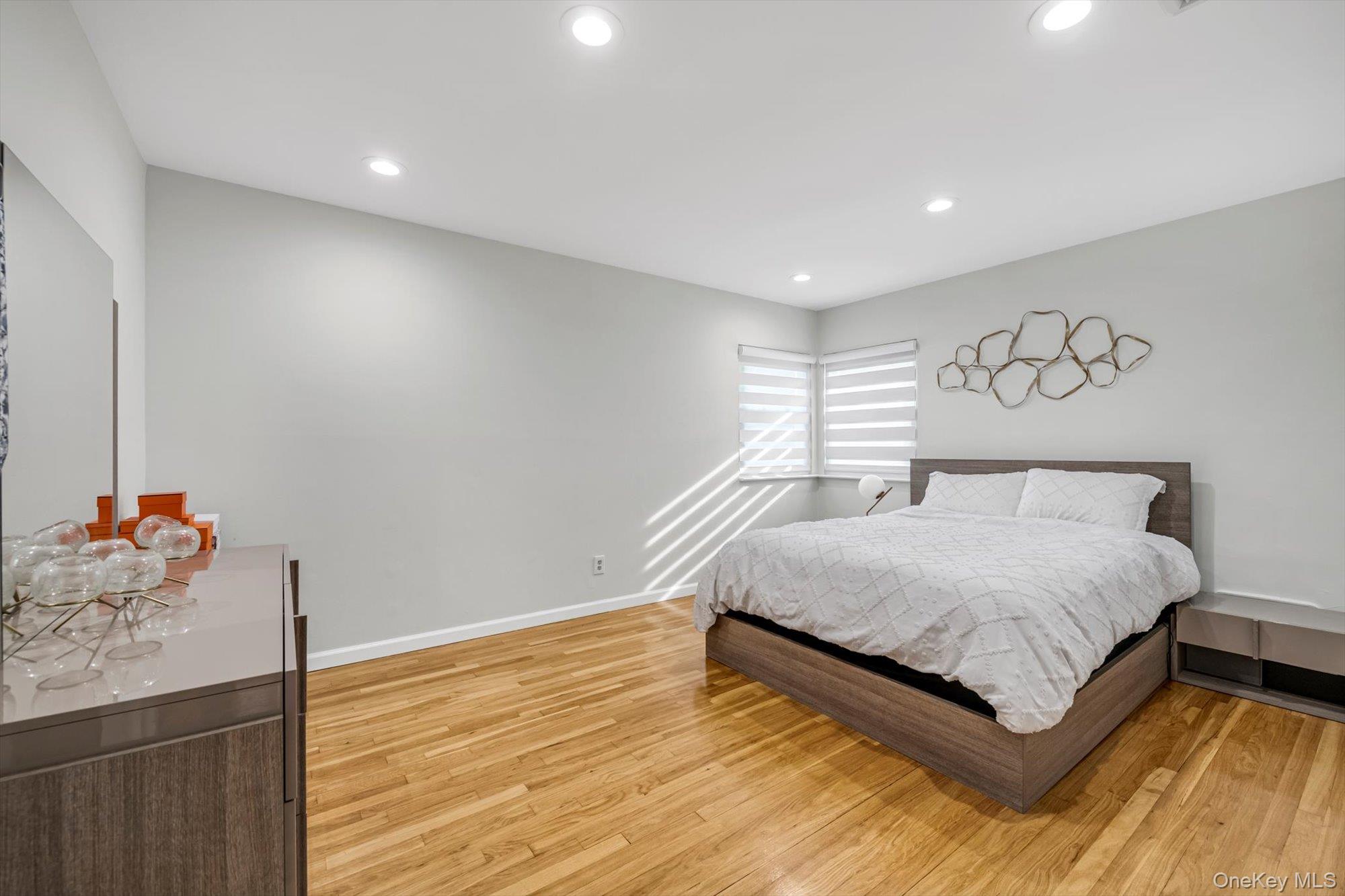 12 Julliard Drive Plainview, NY 11803 - Photo 10 of 23 Bedroom featuring light wood-type flooring and recessed lighting
