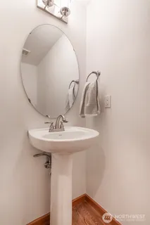a bathroom with a sink and mirror