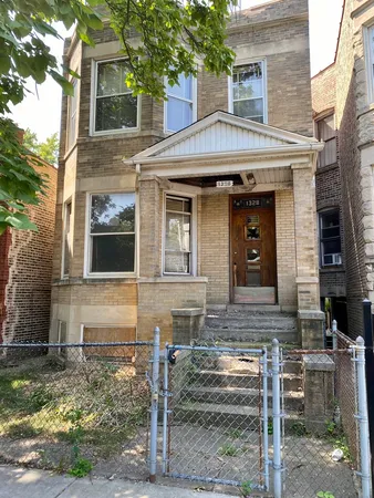 a front view of a house with garage