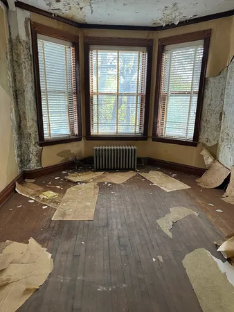 a view of an empty room with a window