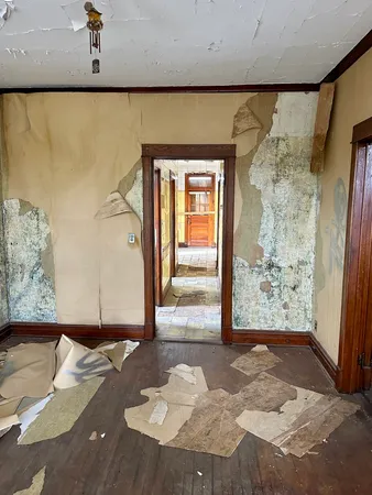 a view of a door with wooden floor