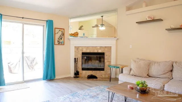 a living room with furniture and a fireplace