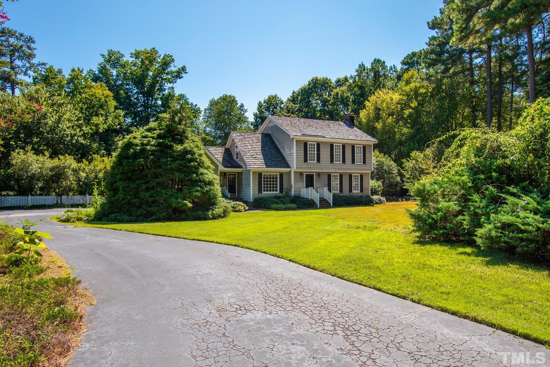 304 Sandhurst Road Raleigh, NC 27615 - Photo 2 of 28 a view of a house with swimming pool and a yard