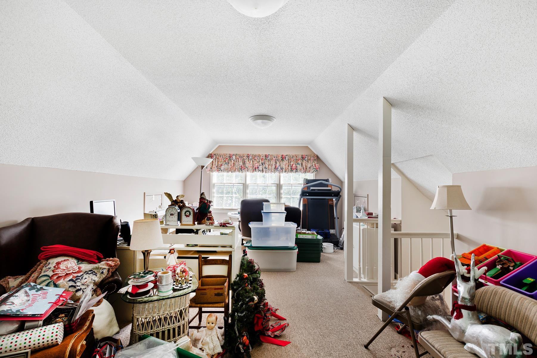 304 Sandhurst Road Raleigh, NC 27615 - Photo 21 of 28 a living room with lots of furniture and a couch