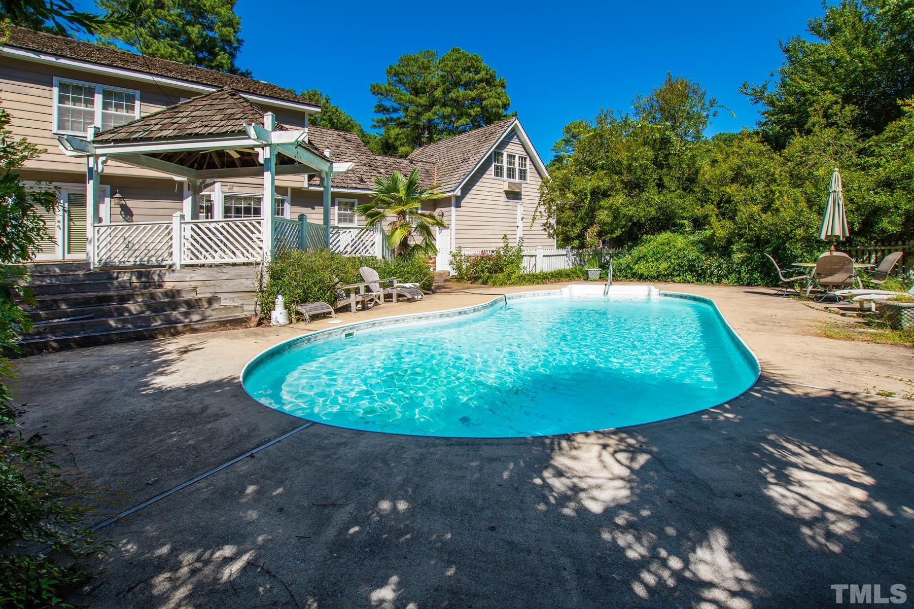 304 Sandhurst Road Raleigh, NC 27615 - Photo 24 of 28 a view of a swimming pool with a patio