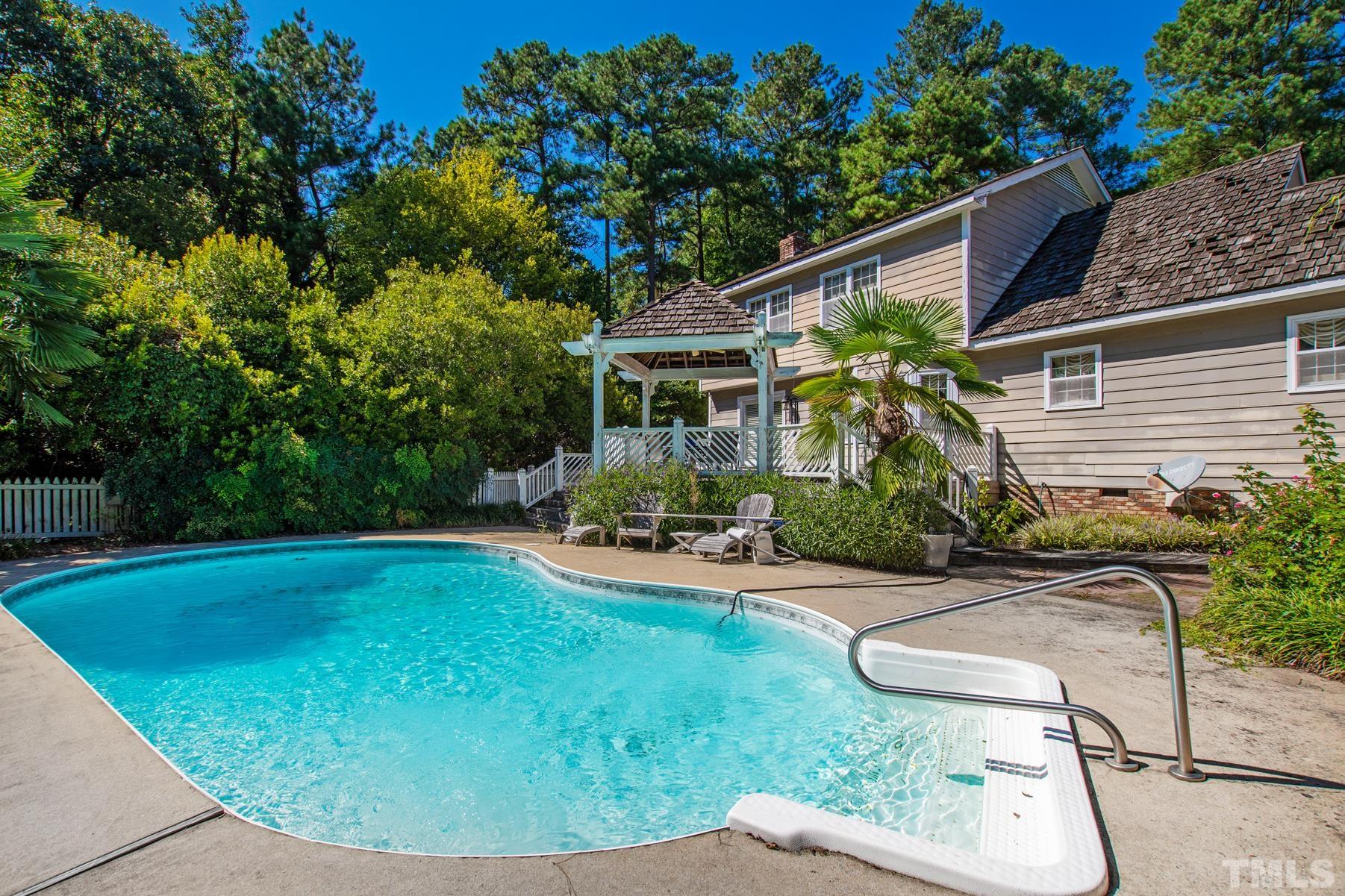304 Sandhurst Road Raleigh, NC 27615 - Photo 25 of 28 a view of backyard with swimming pool and patio