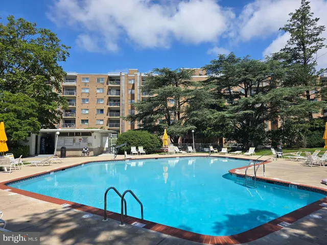a view of a swimming pool with a lounge chairs