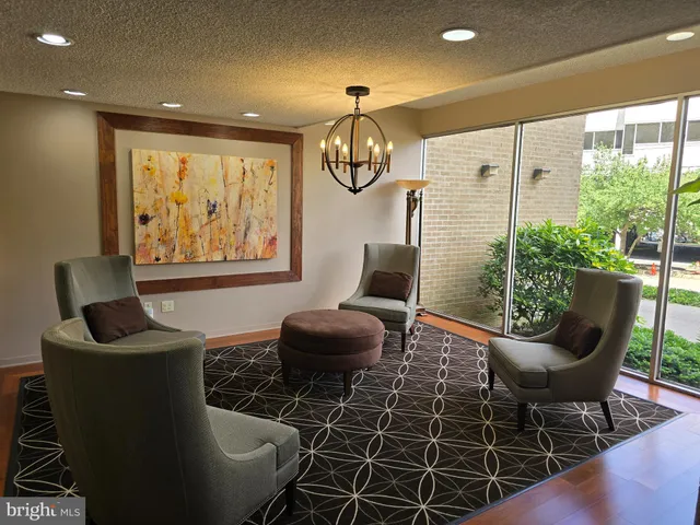 a dining room with furniture and a window