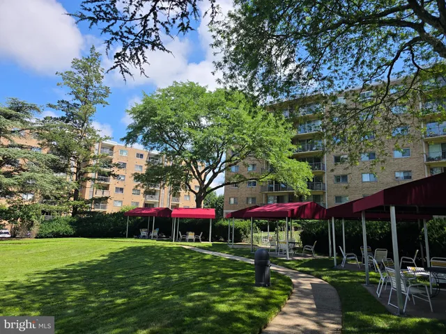 a view of a table and chairs under an umbrella