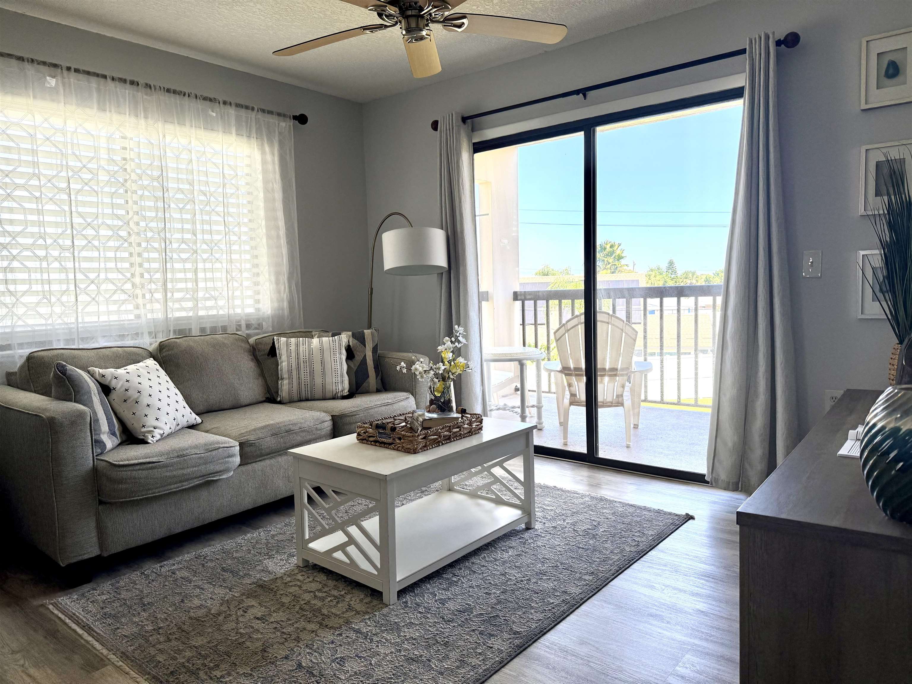 4250 A1A South, Unit M 31 St. Augustine, FL 32080 - Photo 1 of 21 a living room with furniture and a large window