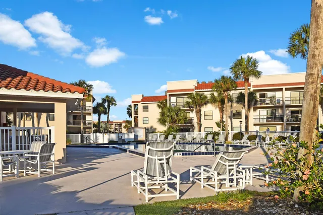 a front view of a building with outdoor seating