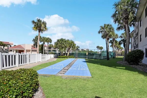 a view of a backyard with swimming pool