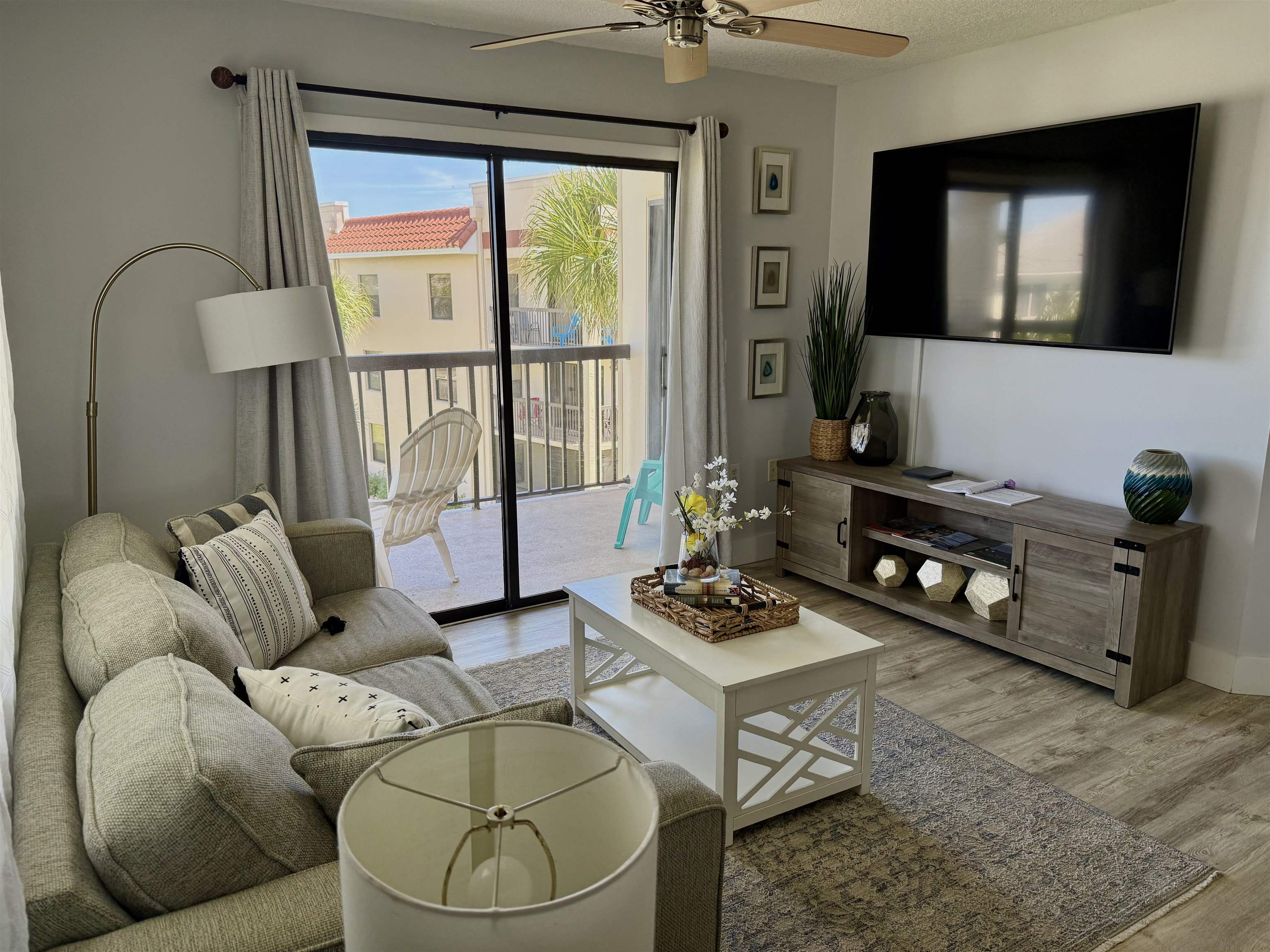 4250 A1A South, Unit M 31 St. Augustine, FL 32080 - Photo 5 of 21 a living room with furniture and a floor to ceiling window