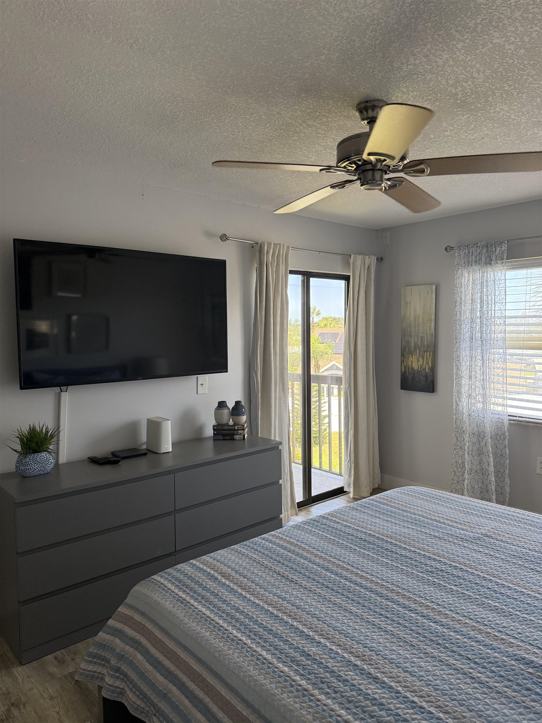 4250 A1A South, Unit M 31 St. Augustine, FL 32080 - Photo 10 of 21 a bedroom with a bed and a flat screen tv