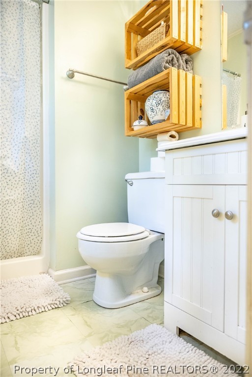 4064 Vass-Carthage Road Carthage, NC 28327 - Photo 29 of 50 a white toilet sitting next to a window