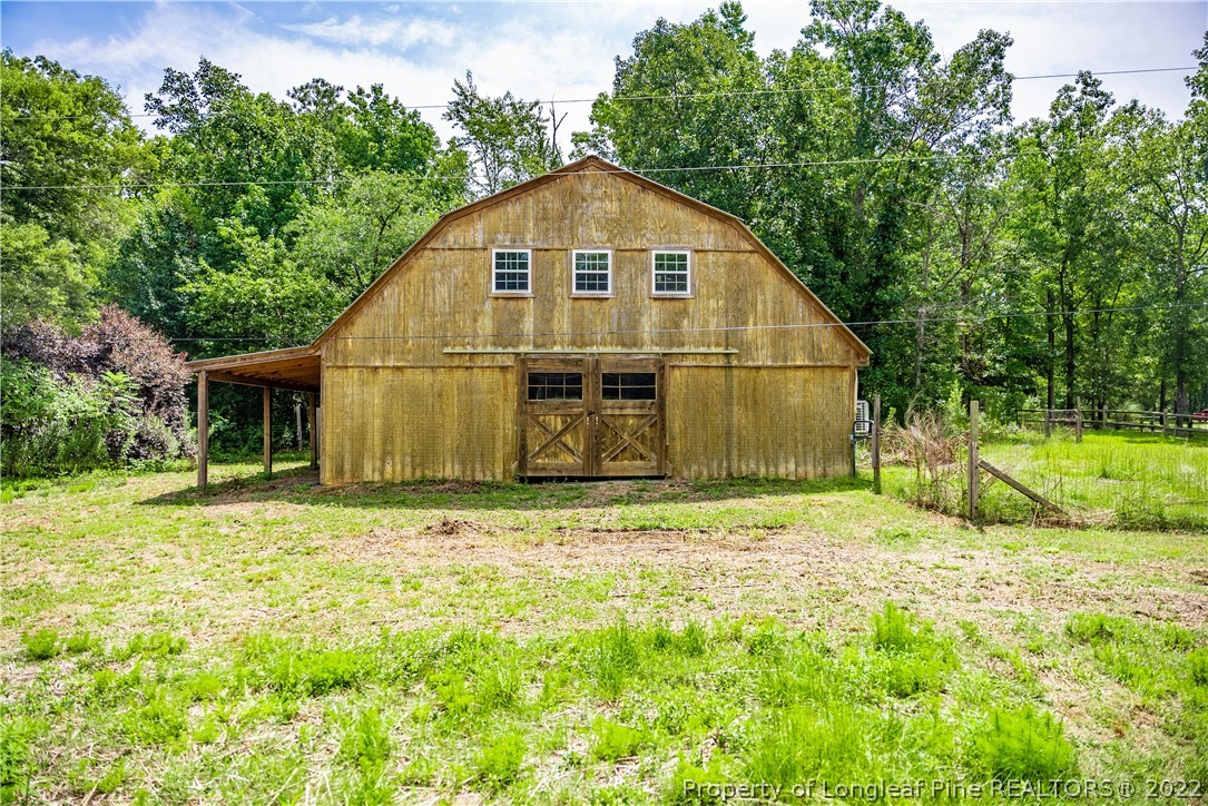 4064 Vass-Carthage Road Carthage, NC 28327 - Photo 3 of 50 a view of a backyard of the house