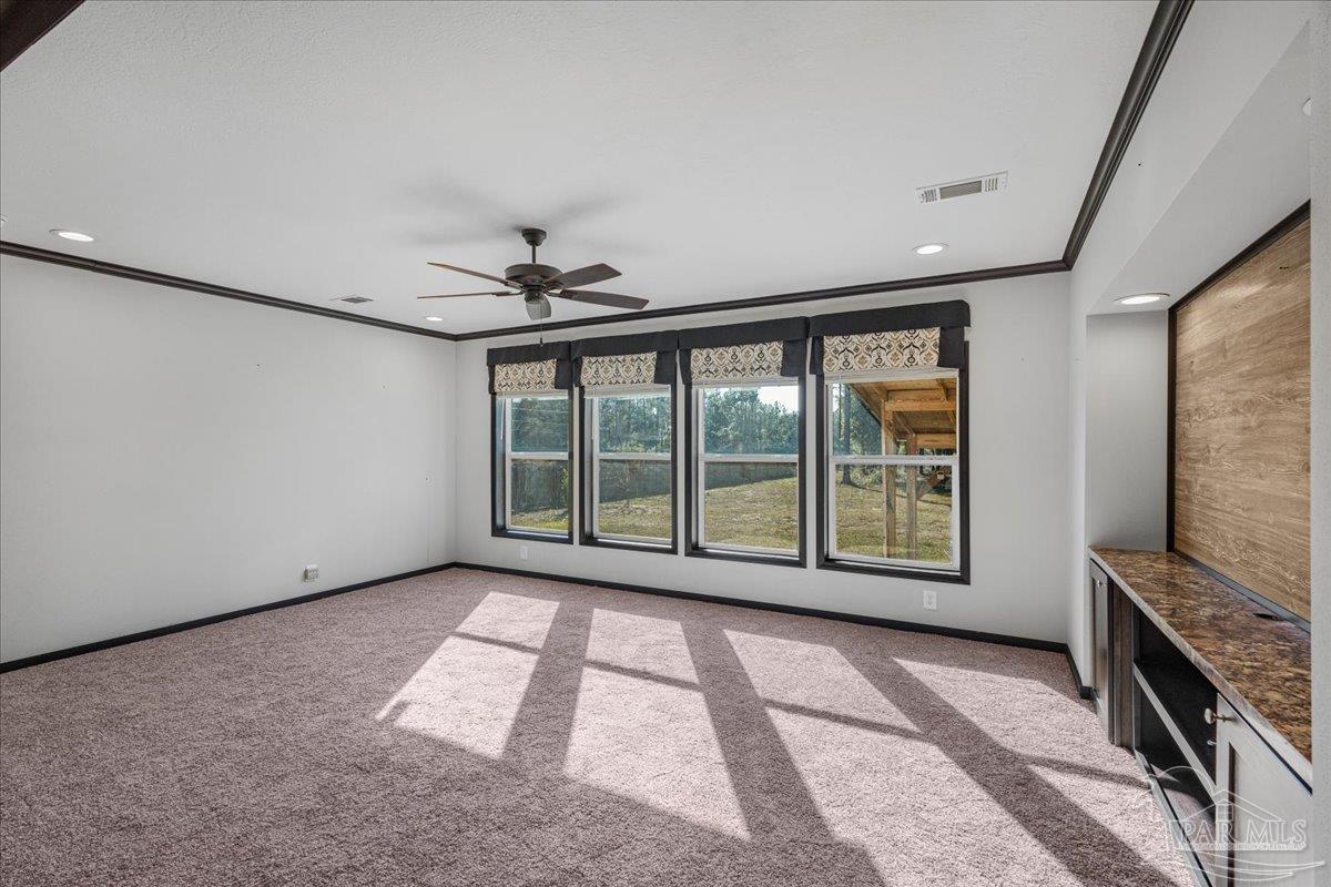 7789 Trinity Baptist Church Road Milton, FL 32570 - Photo 17 of 39 a view of an empty room with a fireplace and a window