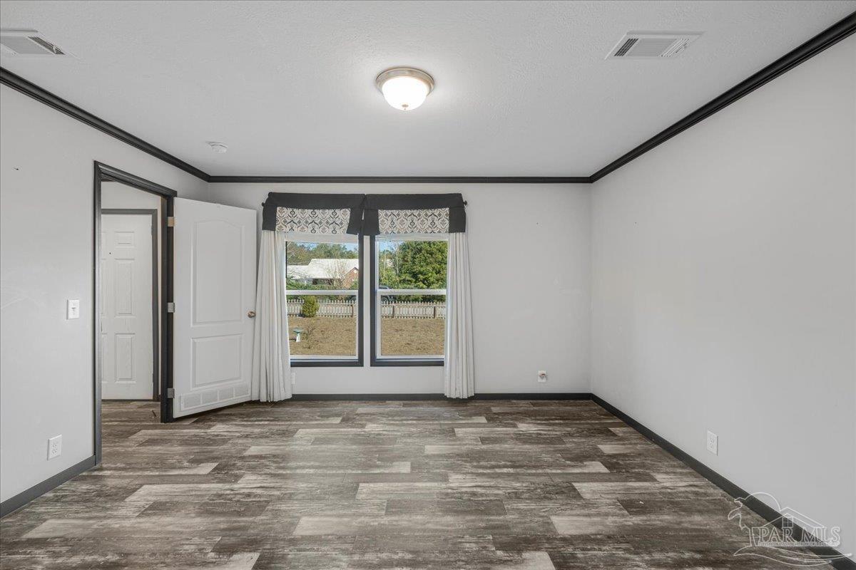 7789 Trinity Baptist Church Road Milton, FL 32570 - Photo 21 of 39 a view of an empty room with a window