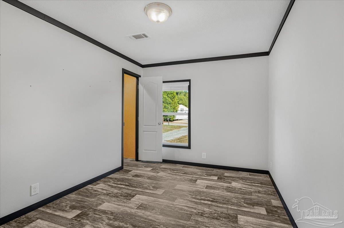 7789 Trinity Baptist Church Road Milton, FL 32570 - Photo 28 of 39 an empty room with windows